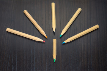 colored pencils on the table