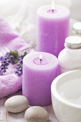 Fototapeta na wymiar SPA products with essential oils and lavender flowers