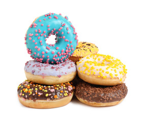 Sweet tasty glazed donuts on white background
