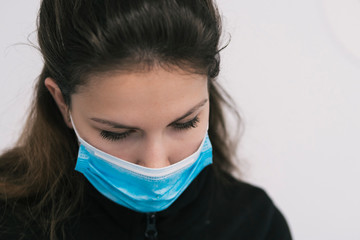 Beautiul caucasian female sanitary with blue protection mask