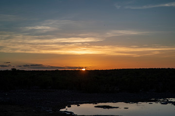 The sun sets at the Moringa Waterhole