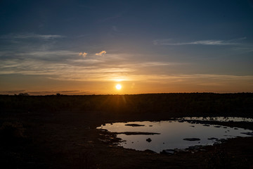The sun sets at the Moringa Waterhole