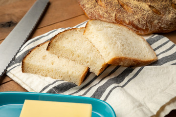 Sliced sour dough bread scene wit butter