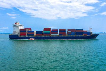 Container , container ship in export and import business and logistics. Shipping cargo to harbor by...