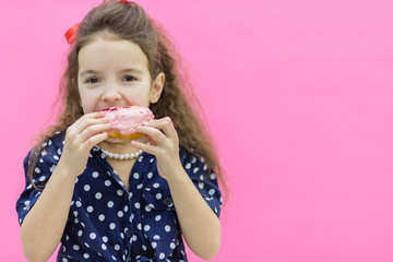 A model holding a glazed donut in hands.