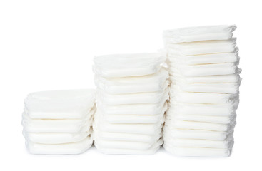 Obraz premium Stacks of baby diapers isolated on white