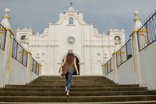 young woman walking up stairs