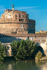 Fototapeta premium castle of the Holy Angel and a bridge with beautiful sculptures of angels on a background of blue sky