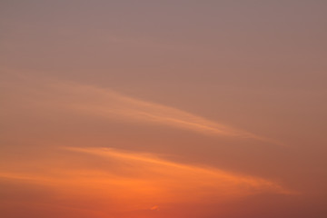 Sunset. Texture of a warm orange sky. Space for text.
