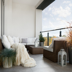 Balcony with wicker furniture - 350290774