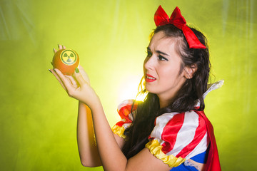 Woman holding hazardous radioactive apple. Nuclear and radiation measurement concept.