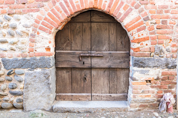 Original medieval wooden door; photo taken in Italy