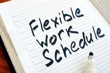 Flexible Work Schedule sign in the notepad.