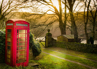 Fototapeta premium An old english red telephone box on a hiking route around the Peak District National Park, England