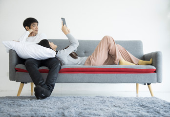 Couple on a sofa with Notebook