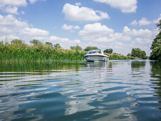 River boat on the River Thames in the Cotswolds , Oxfordshire England. UK