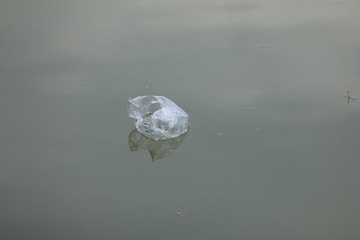 garbage plastic bag in water