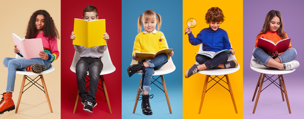 Diverse stylish kids reading textbooks
