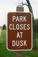 Park Closes At Dusk Sign