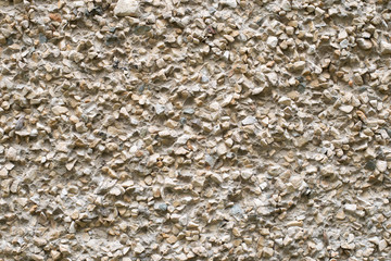 Flintstone in a frozen cement mortar, pattern, background, texture. stone wall