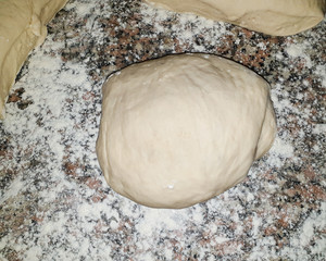 homemade dough on dusted flour - top view