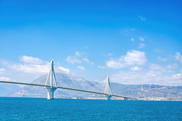 The famous cable bridge Charilaos Trikoupis in Rio Antirio Greece on a sunny day with a blue sky