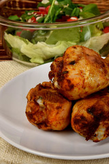 roasted chicken legs with lettuce and peppers