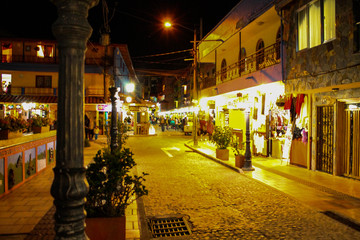 Night in the colonial streets of the municipality of Guatape with intense light, Guatape, Antioquia, Colombia.