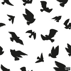 Seamless pattern of black silhouette of flying birds.