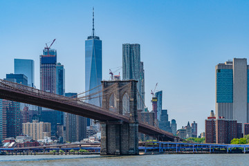 Brooklyn Bridge with lower Manhattan skyline, One World Trade Center in New York City.