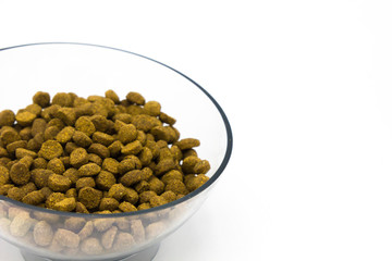transparent plastic bowl of pet food isolated on white background. Close up. Space for text. Cats food. Dogs food. Pets care veterinary concept.