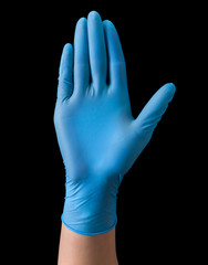 Doctor's hand in sterile medical gloves showing palm in warning sign isolated