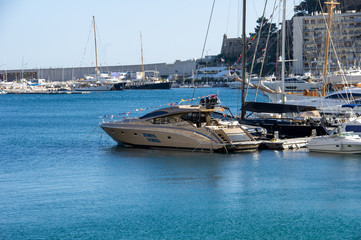 Fototapeta premium Mediterranean sea landscape. Marina with different yachts and mountains background.