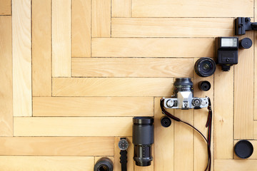 Old type photography equipment on wooden floor