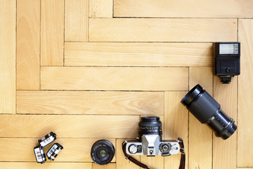 Old type photographic equipment on wooden floor