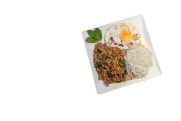 Thai food, Stir-fried hot and spicy pork with holy basil, served with white rice on white background.