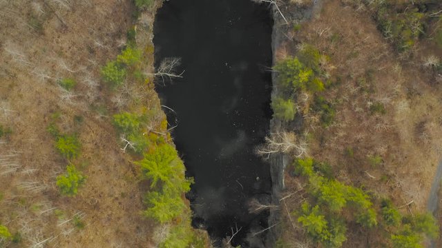 Abandoned open slate pit mine top down aerial Monson, Maine
