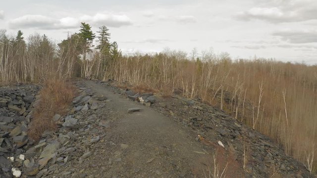 Piles of slate and rock from slate quarry Monson, Maine 