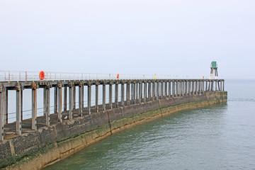 Fototapeta na wymiar Whitby Harbour Wall, Yorkshire