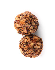 Delicious chocolate candies with waffle crumbles isolated on white, top view