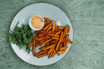 Fried fries and sauce closeup.