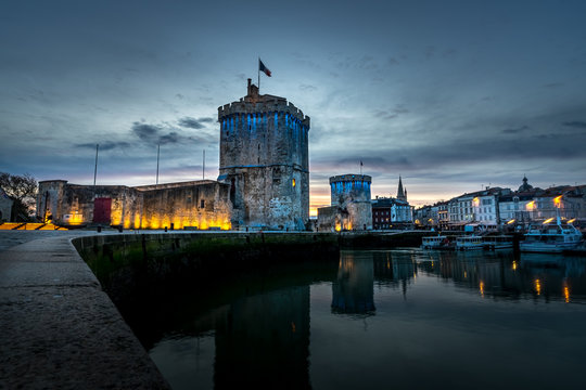 Old harbor of La Rochelle, the French city and seaport located on the Bay of Biscay, a part of the Atlantic Ocean. cloudy sky