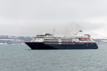 Expedition ship in Arctic sea, Svalbard. Passenger cruise vessel. Arctic and Antarctic cruise.