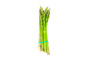 Fresh green asparagus isolated on white background. Bunch of fresh asparagus. Creative healthy food concept. Flat lay.