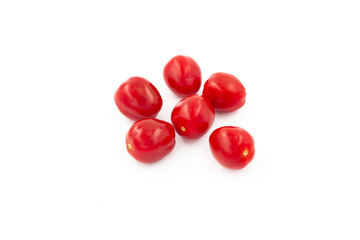 Fresh cherry tomatoes isolated on white background. Creative healthy food concept. Flat lay.