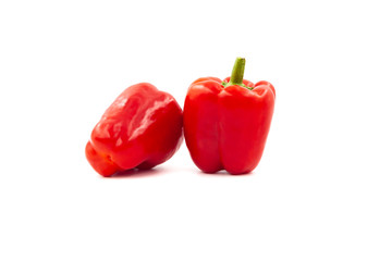 Two fresh peppers isolated on white background. Red sweet paprika isolated.