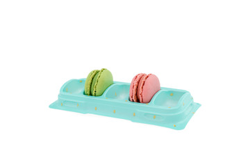 Macaroons green and pink in a box