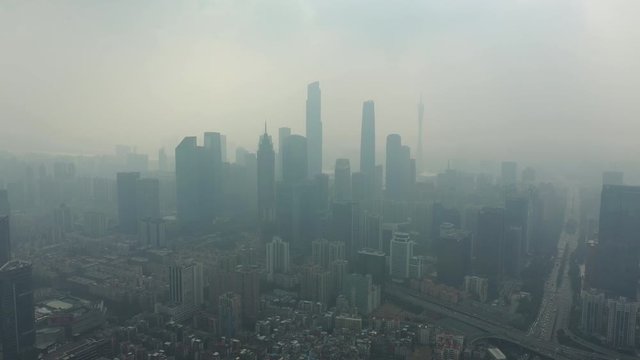 summer day smog guangzhou city downtown district traffic street aerial panorama 4k china