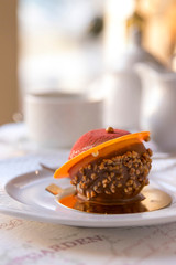 tender dessert on a white plate in a cafe