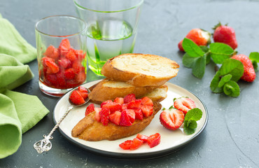 Bruschetta with strawberries and basil. Selective focus